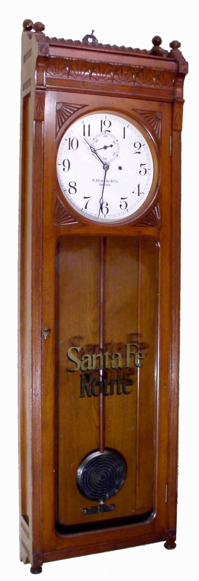 E. Howard and Co., Boston, "REGULATOR No. 72", for the Santa Fe Railway, La Junta, Colorado station, in walnut, 8 day weight, and with original Santa Fe maintenance sticker behind the dial plate, c1890. — Antique Clocks Price Guide