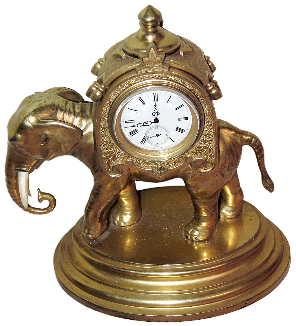 French, gilt bronze and brass figural timepiece in the form of an elephant carrying a sedan on his back, run by a lever escapement watch movement. — Antique Clocks Price Guide