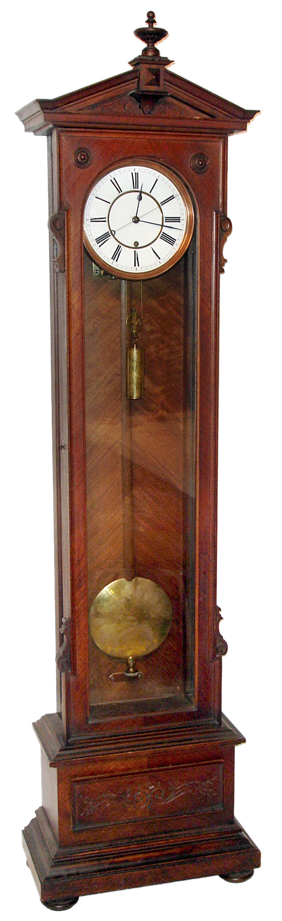 Lenzkirch Clock Co., Germany, floor standing jeweleris regulator, 8 day, time only, weight driven movement with center sweep secondis hand in a walnut veneer case with a carved top and base highlight and turned center finial all on four bun feet, two piece white porcelain enamel dial with spade hands, c1901 — Antique Clocks Price Guide