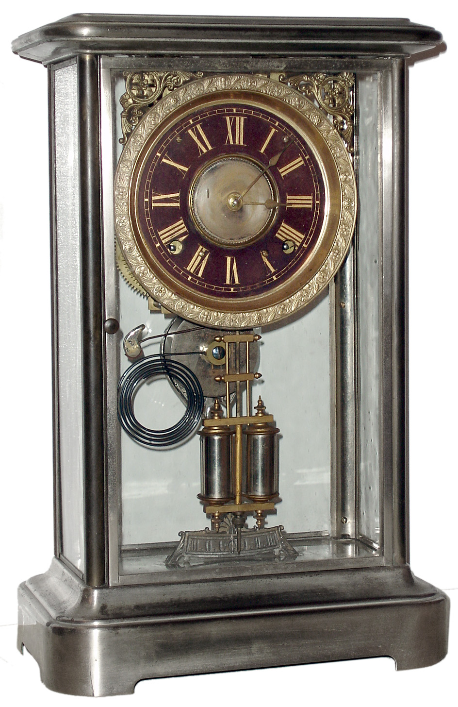 Ansonia Clock Co., Ansonia, Conn., "Symbol", 8 day, time and strike, spring driven movement in nickel plated brass and glass case, c1880 — Antique Clocks Price Guide