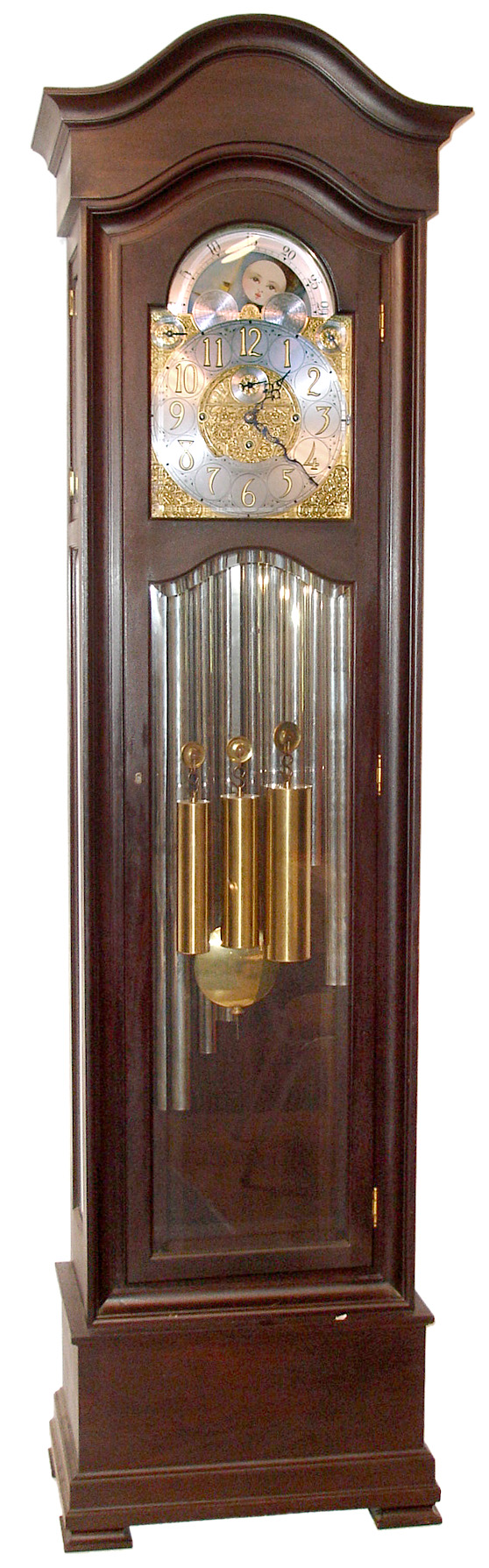 Waltham Clock Co., Waltham, Mass., 9 tube hall clock, 8 day, time, strike and chime, weight driven movement playing Whittington, Westminster, or St. Michael's tune in mahogany case with six heavily beveled glasses. The silvered arched dial has applied brass numerals, finely cast spandrels and dial center, moonphase, selection for tunes or silent, and second's bit, c1918 — Antique Clocks Price Guide