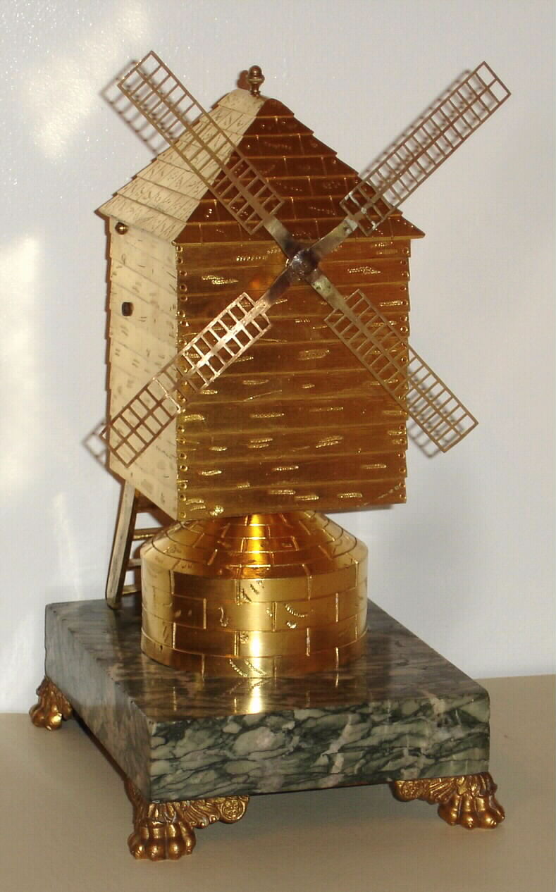 French Industrial "Windmill" only driven by a spring clock work mechanism housed in a gilded brass case on a marble base with four paw feet, c1890 — Antique Clocks Price Guide