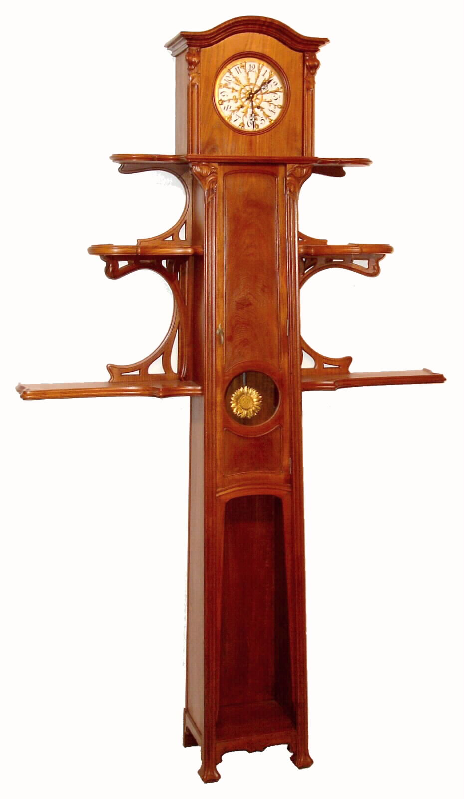 French tall case clock in Art Nouveau style, 8 day, time and strike, spring driven movement in walnut case with floral carvings and stamped on the back board "J. FRANCOIS" with address. There are three tiers of shelves flanking the case with stylized carved and curved supports. The white enamel dial has cast brass floral mask, c1890 — Antique Clocks Price Guide