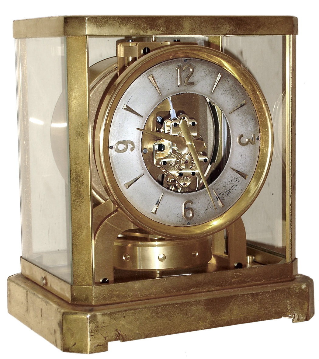LeCoultre, Switzerland "Atmos", 15J, self winding perpetual running time piece in a brass and glass case, s#32297, c1945 — Antique Clocks Price Guide