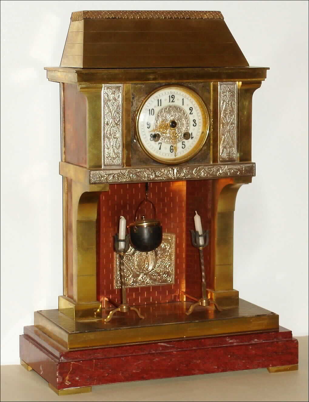 French, Vicenti and Cie, 8 day, time and strike, Industrial "Cooking Pot" mantel clock in the form of a large fireplace with an original fireplace crane, a cook pot and andirons. Pot hangs from the crane and acts as the pendulum. Movement is also marked: "Miroy Fres Btes, S.G.O.G., C. M. Paris", c1880 — Antique Clocks Price Guide