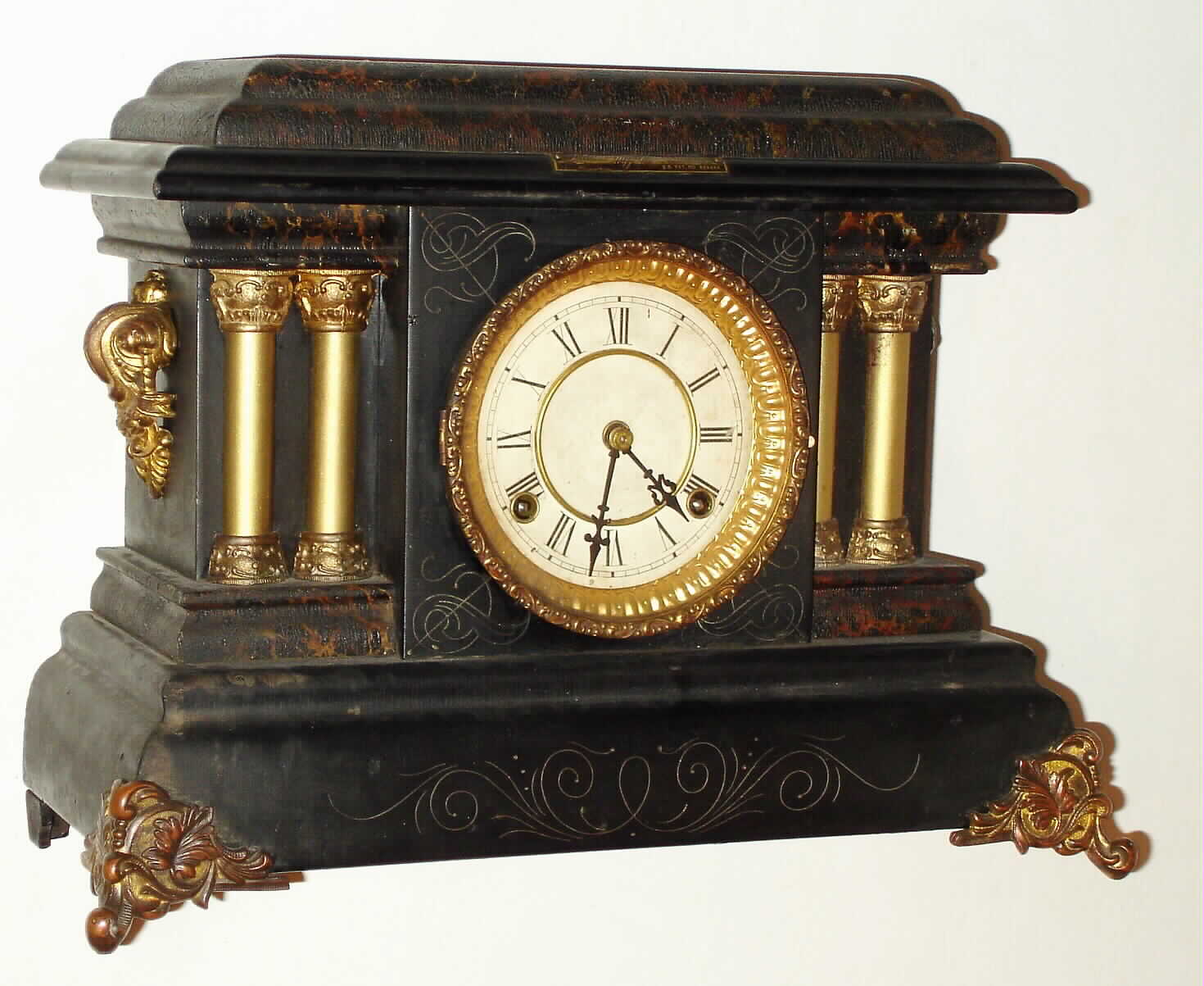 Loheide Mfg. Co. Wizard Clock Trade Stimulator, nickel play. Loheide Mfg bought the "DeSoto" black mantel clock from Waterbury and modified it to dispense chits for redemption. At the turn of the last century, trade stimulators were common throughout the US in cigar stores, confectionaries, general stores, and just about any other point of sale location. The logic is as follows: say you stopped at the corner store for eggs, as that was all you needed. Seeing this clock, there might be a sign touting "win two packs of gum for the price of one, 5 cents". Now you don't need the gum, but the thought of getting 2 for one is irresistible, so nearly every patron would drop in his nickel and get at least a chit for one pack of gum [the standard retail transaction]. A small percentage of patrons got two packs, and were always noisy about it, adding to the excitement, c1907 — Antique Clocks Price Guide
