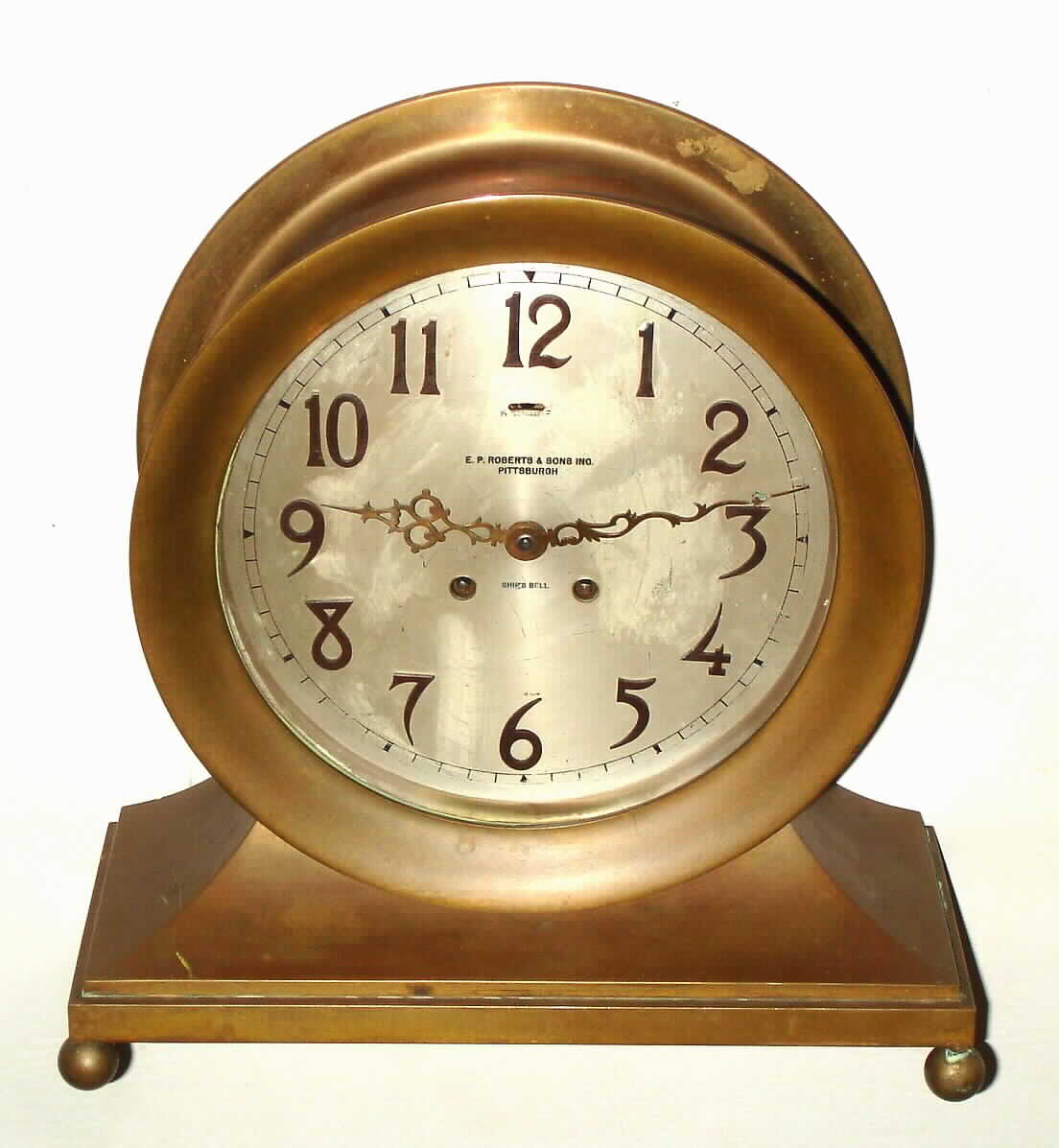 Chelsea Clock Co., Boston, Mass., "Base and Ball" or also named the "Commodore", 8 day, time and ship's bell strike, brass mantel clock with 8 1/2" silvered metal dial signed and retailed by E. P. ROBERTS and SONS INC. PITTSBURGH," s#71117 c1911 — Antique Clocks Price Guide