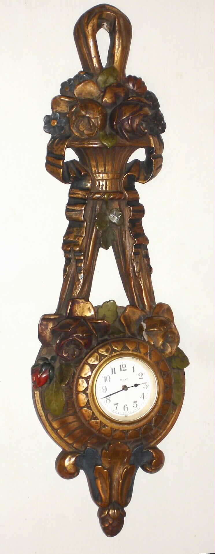 New Haven Clock Co., 8 day polychrome molded composite hanging novelty clock, c1910 — Antique Clocks Price Guide