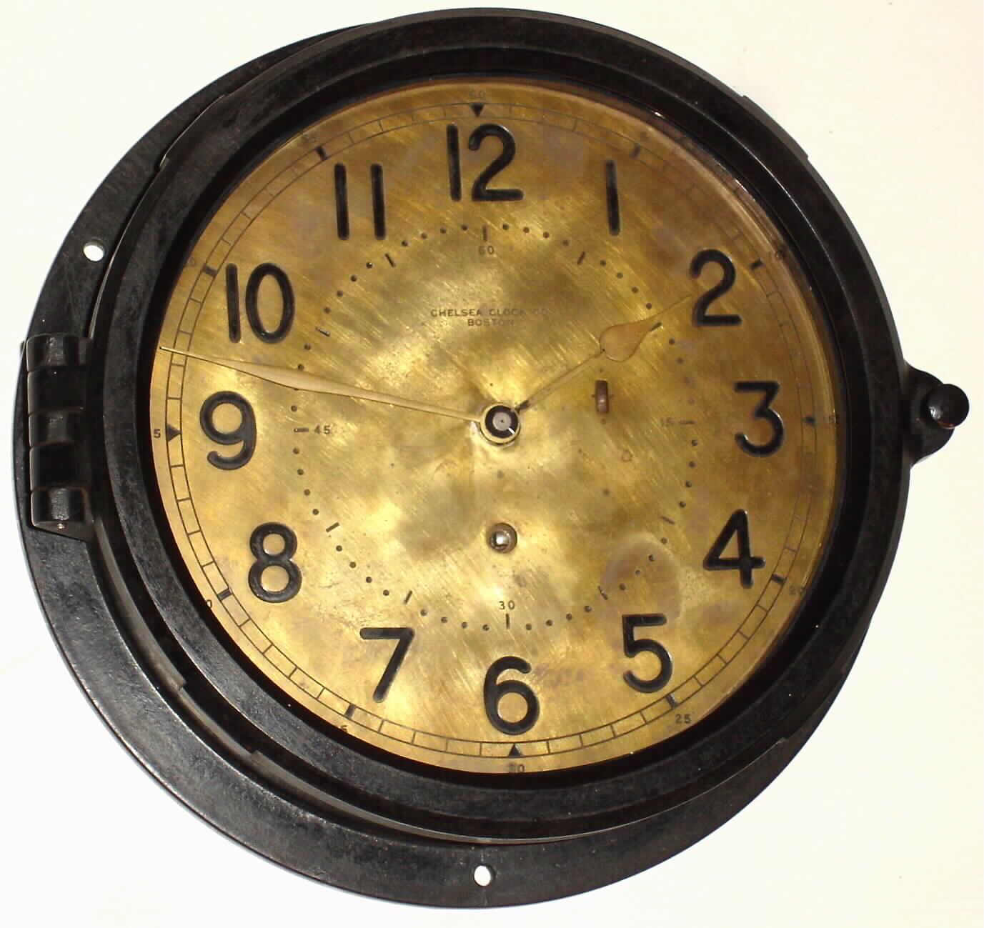 Chelsea Clock Co. black phenolic 8 day 8" brass dial timepiece, c1957 — Antique Clocks Price Guide