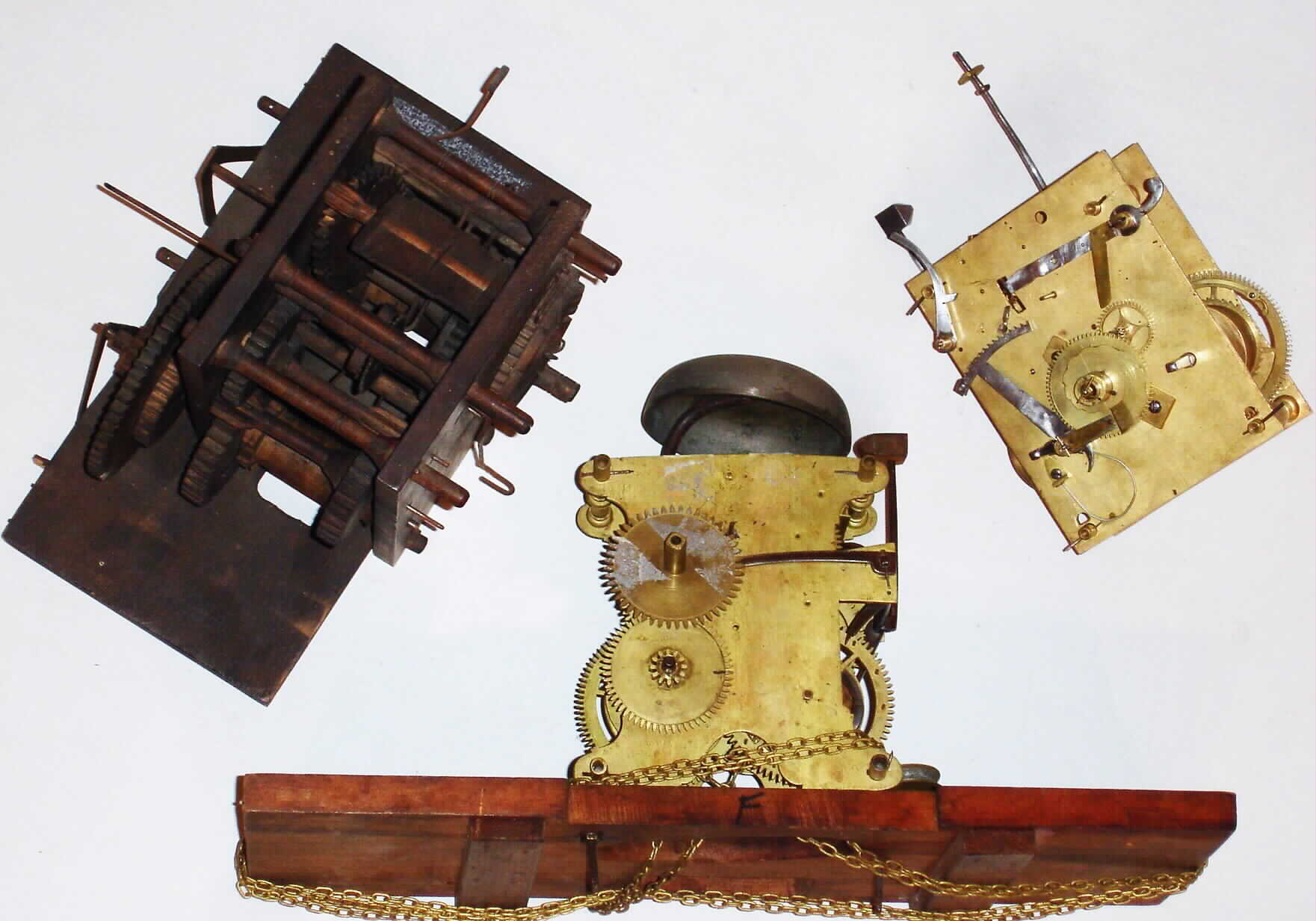 Long case Striking Clock Movements- 3 (Three): English 8 day long case 30 hour wooden works; American (?) 30-hour continuous chain, 19th century — Antique Clocks Price Guide