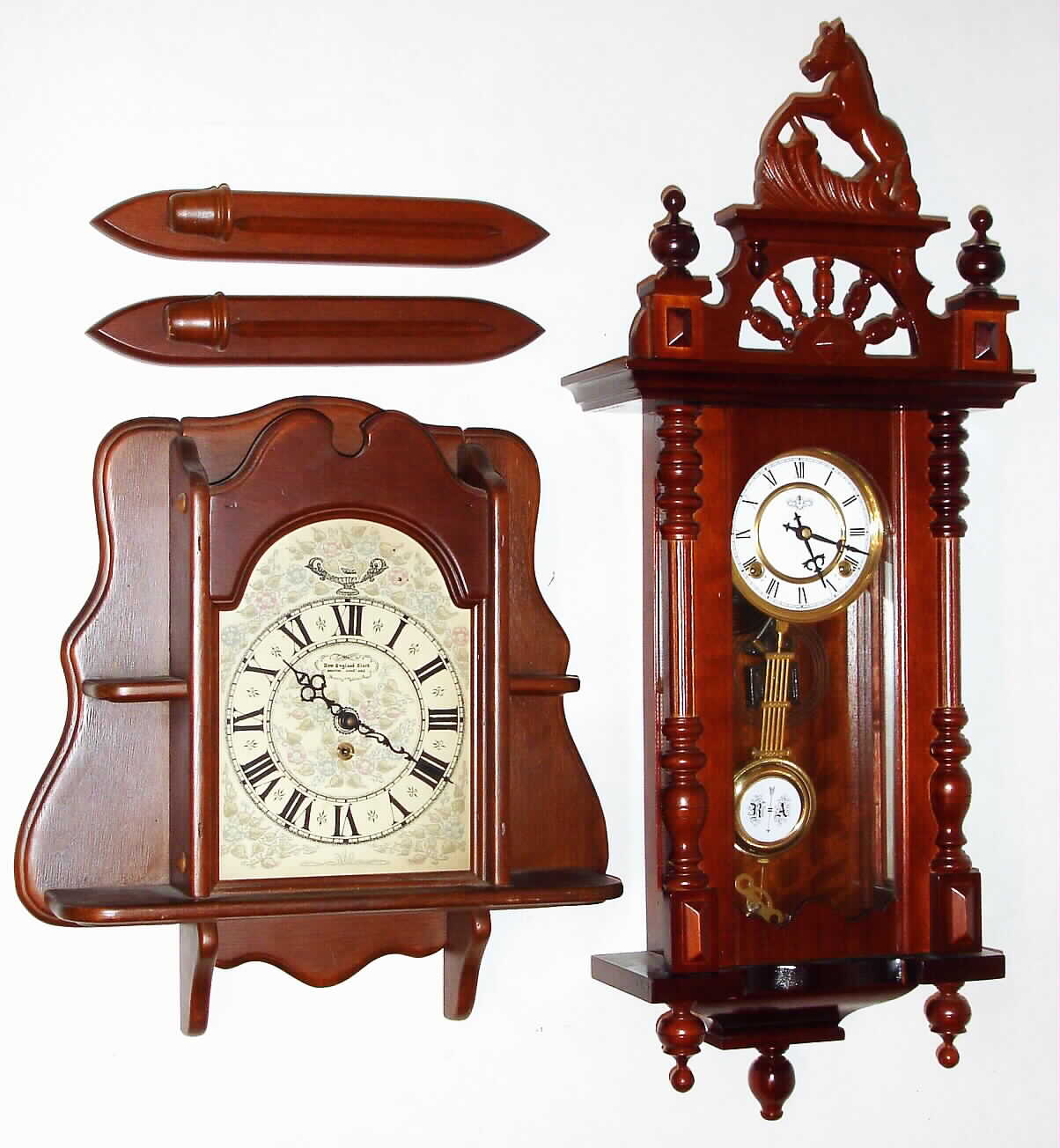 Clocks- 2 (Two) Wall Clock Reproductions 8 day: DEA R/A striker with large crest; New England time only with shelves and sconces — Antique Clocks Price Guide
