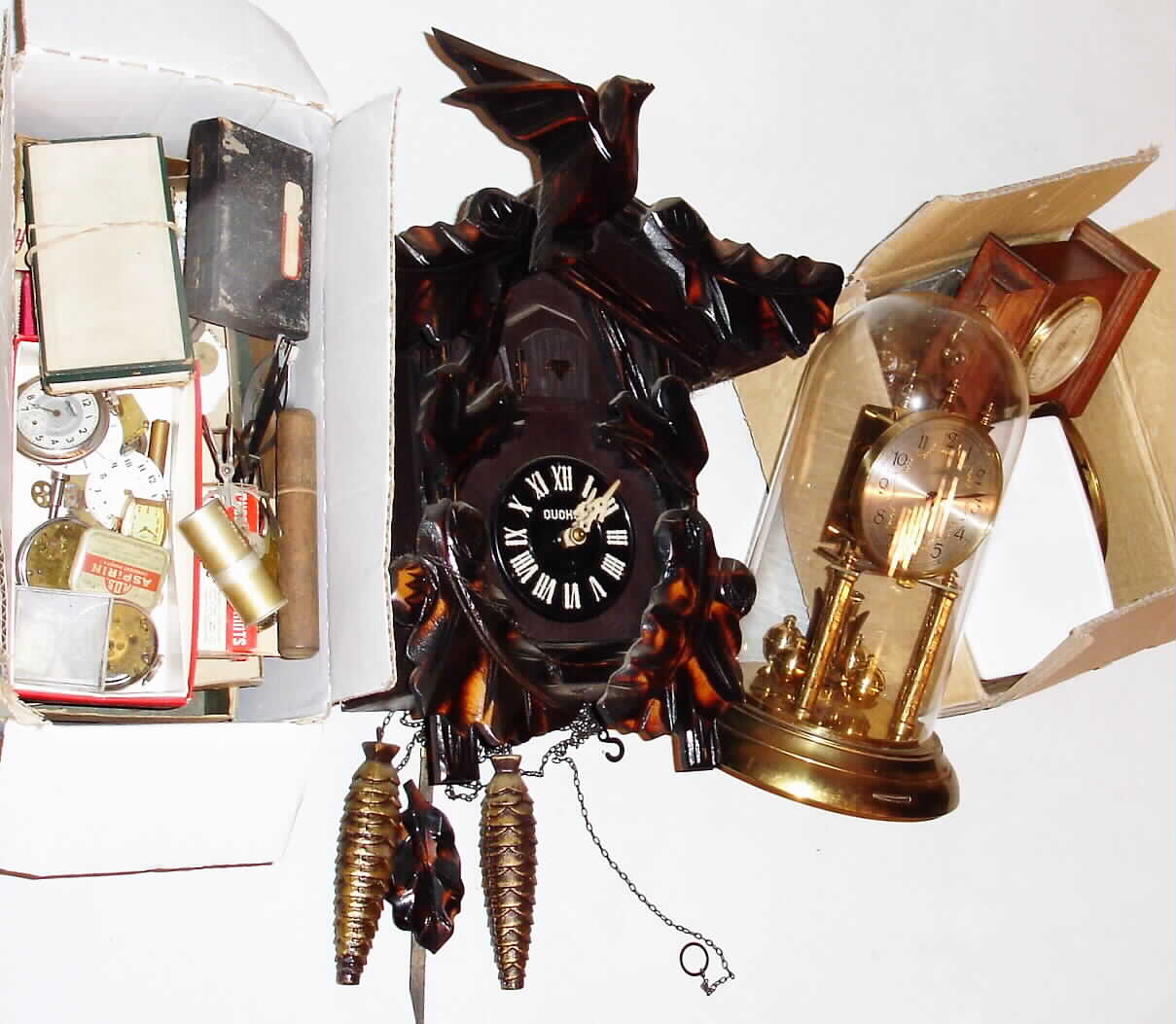 Clocks- 2 (Two) and watch and clock parts and tools: a modern cuckoo a Shulz 400 day clock, watch and clock movements, tools and spare parts — Antique Clocks Price Guide