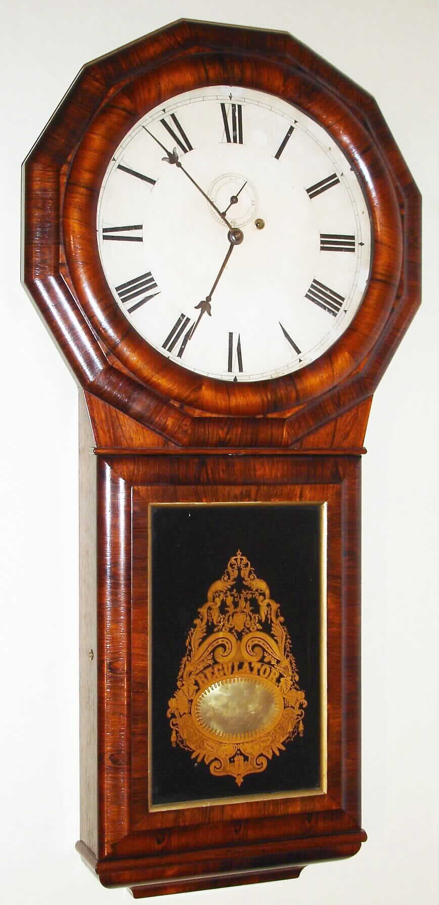 Seth Thomas Clock Co., Plymouth Hollow, Conn., "Regulator No. 1 Extra" wall clock 8 day time and strike weight driven movement in rosewood veneered mahogany case with reverse painted tablet and painted metal dial, c1875 — Antique Clocks Price Guide