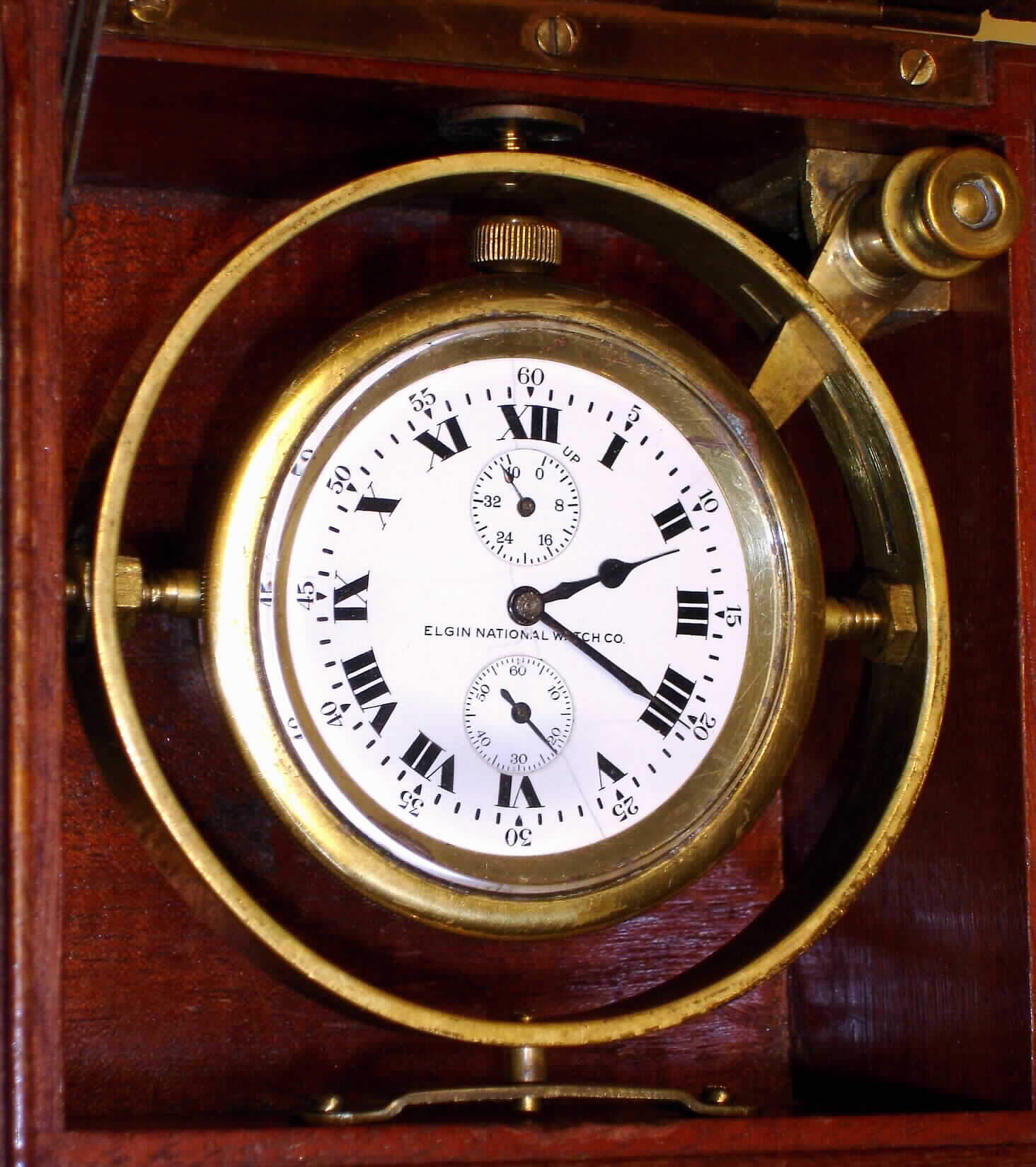 Elgin Watch Co. Father Time deck watch grade 367 with wind indicator 16S 21J, stem wind, lever set, damascene nickel movement with free sprung lever escapement and 2 1/4" Roman numeral porcelain single sunk dial, s#21869703 in gimbaled mahogany box — Antique Clocks Price Guide