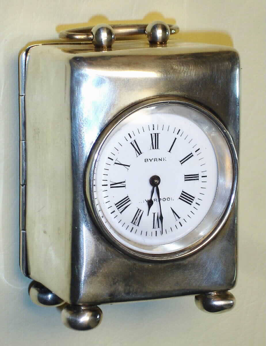 French for retailer Byrne, Liverpool, England miniature carriage clock, 8day, time only, spring driven movement with platform escapement in sterling silver case with Roman numeral white enamel dial, c1890 — Antique Clocks Price Guide