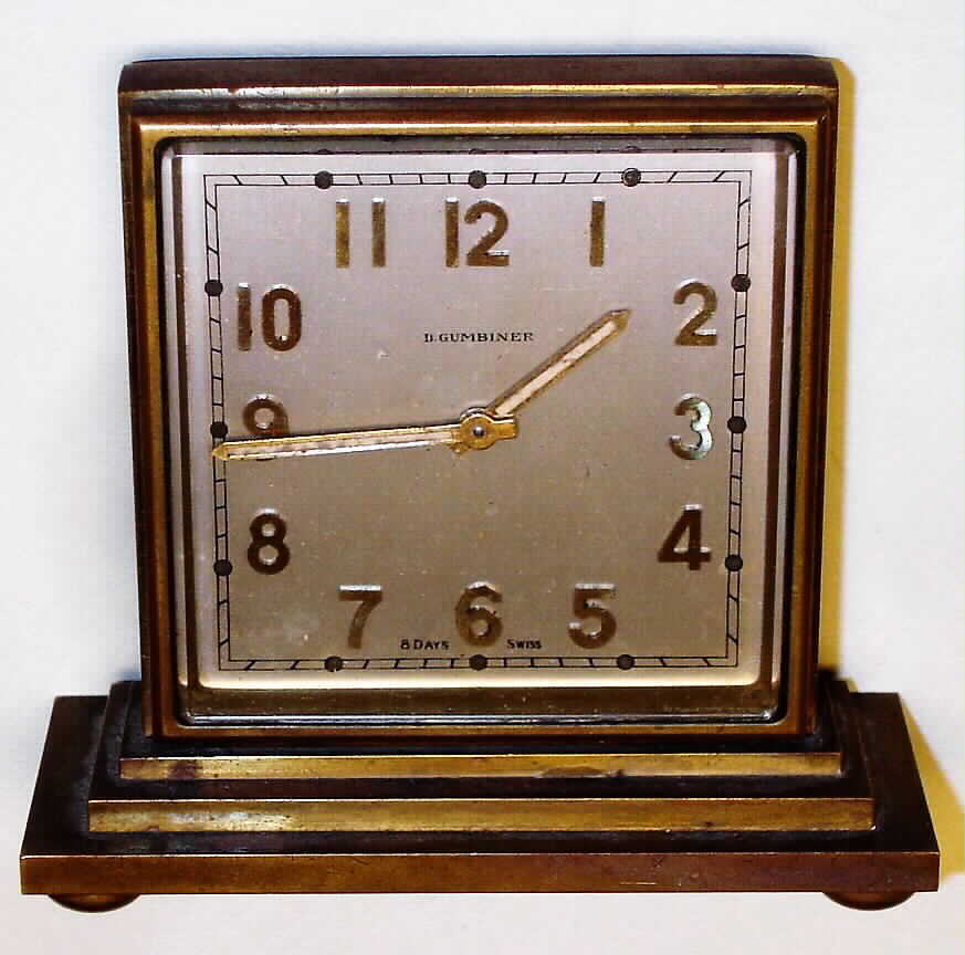 D. Gumbiner, Swiss desk clock or partners clock, 8 day, time only, spring driven movement in brass case with double sided Arabic numeral metal dial, c1910 — Antique Clocks Price Guide