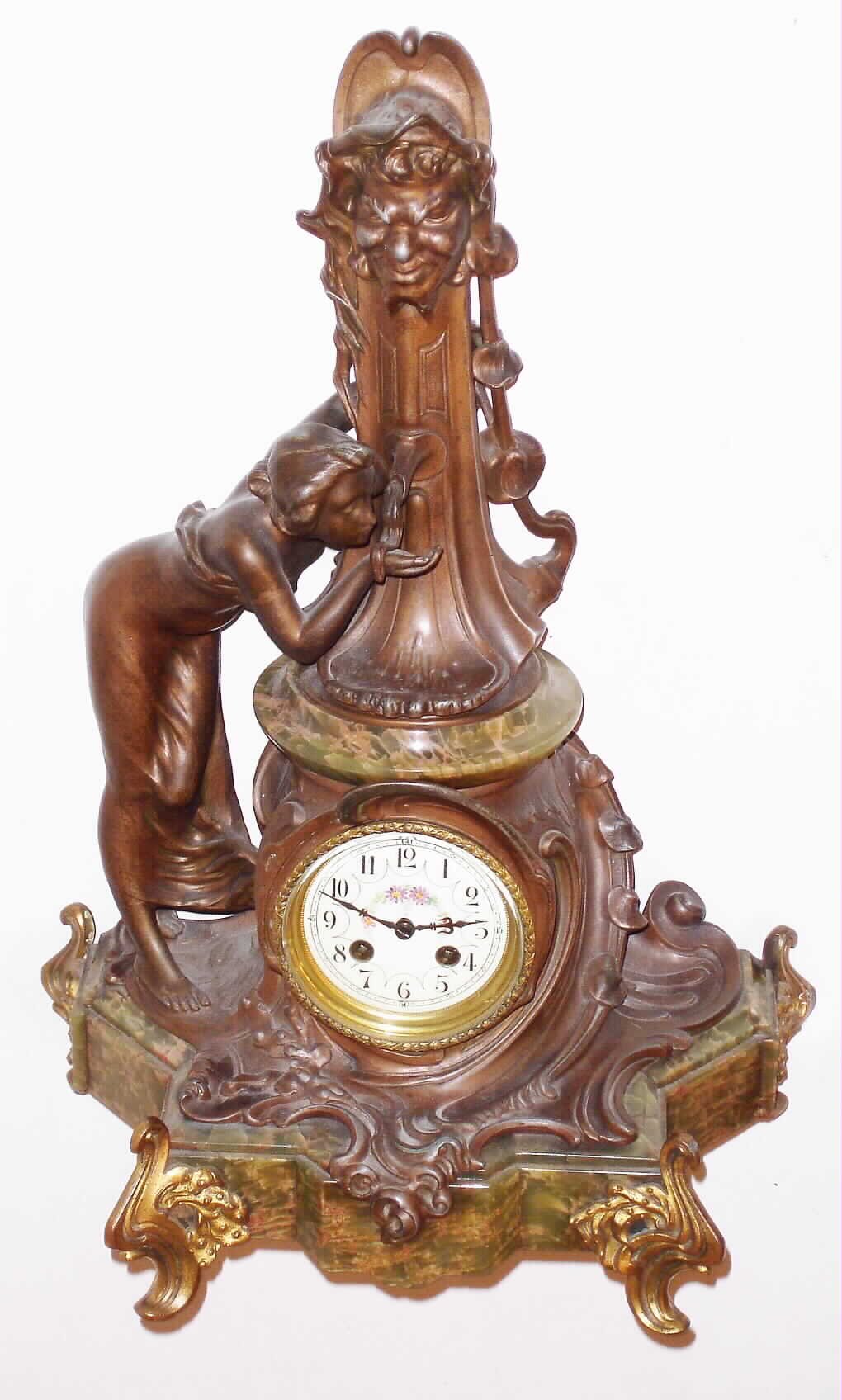 Japy Freres, French figural mantel clock, 8 day, time and bell strike, spring driven movement in bronze and green variegated marble case depicting a lady gently bending forward and drinking from a fountain with multicolor enamel dial, c1890 — Antique Clocks Price Guide