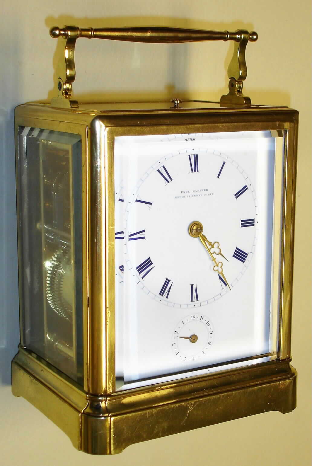 Paul Garnier, Paris, France Series III carriage clock in brass corniche case with 8 day, time, half hour bell strike, hour repeat and alarm, spring driven movement with original chaff cutter platform escapement and Roman numeral white enamel dial, c1860 s#3018 — Antique Clocks Price Guide