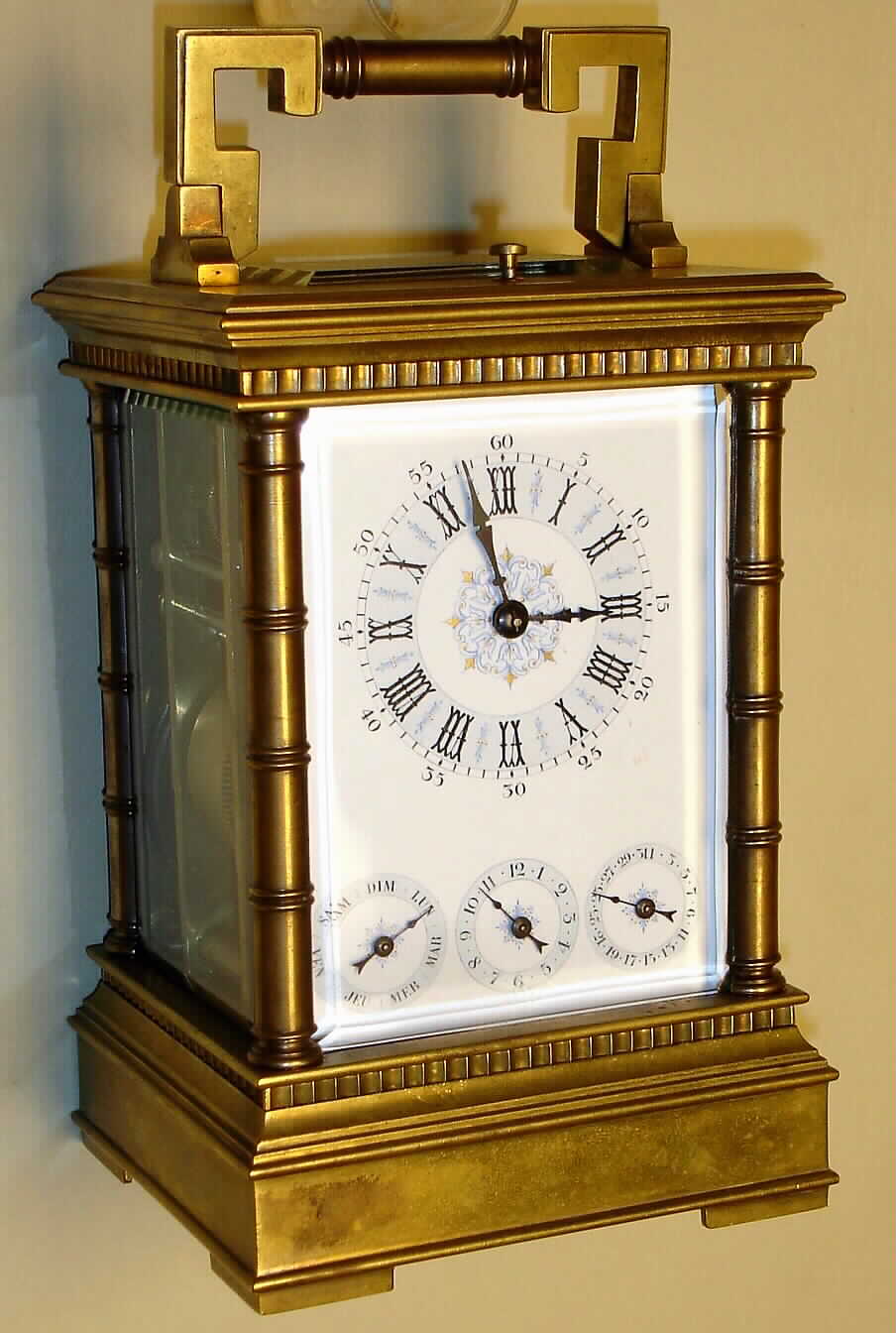 France, carriage clock, Grande Sonnerie with calendar, alarm and repeat in Anglaise brass case with turned columns, 8 day, spring driven movmement with multicolor Roman numeral whtie enamel dial, c1885 — Antique Clocks Price Guide