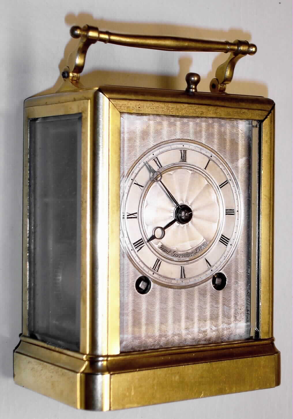 Paul Garnier, Paris, France a small Series I carriage clock in brass corniche case with 8 day, time and half hour bell strike, spring driven movement with original chaff cutter platform escapement and engine turned silver dial, c1840 s#506 branded onto topside of bottom board, including leather travel case — Antique Clocks Price Guide