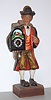 German, Clock peddler / whistler, holding a running clock and whistling a lively tune at will, c1970