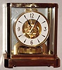 Jaeger-LeCoultre Swiss "Atmos" table clock, jeweled movement runs on changes of atmospheric pressure and temperature, gold-plated brass and glass case, serial number 562373, c1975
