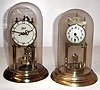 Clocks- 2 (Two) German 400 day disk pendulum brass clocks with glass domes, 20th century