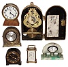 Clocks- 6 (Six) small clocks including A.Stowell, Boston, French carriage clock, alarm clocks, and a commercial time-switch. early 20th century