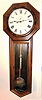 Seth Thomas Clock Co., Thomaston, Conn., "REGULATOR No. 18" walnut cased long drop octagon, weight driven, meter pendulum and with large nickel plated bob with damascene pattern, plus matching weight and pulley, c1883.