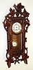 German, miniature "RA" wall clock in a "Bird and 7-leaf with Cuckoo" format, the door surrounded with vines, and the small spring movement with 7 wheels in the train to achieve 8 day duration, c1880
