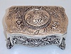 German, Singing Bird in a .925 Silver box, embossed with images of children playing the flute and lute, also conducting. This is not an old box, probably, c1995