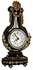 French, miniature lyre form timepiece with gilt elements, applied to an ebonized wood frame, and brilliant surround run by an 8 day platform escapement movement, c1900.