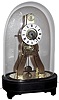 R. Holt and Cie, Paris, France miniature skeleton clock for the English market, 8 day, time and alarm, spring driven movement introduced at the Great Exhibition of 1851 in London, signed on the dial and movement. Includes original glass dome on ebonized base, c1860