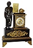 French bronze and ormolu figural mantel clock, 8 day, silk thread suspension, time and bell strike, spring driven movement with unusual automatic beat adjustment designed to keep the pallets centered by gravity on the pallet arbor in well patinated case with Roman figure holding tablet with the title of Virgil's works, accented with ormolu appliques and spandrels with a musical motif and a Roman numeral white enamel chapter ring, c1810