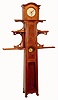 French tall case clock in Art Nouveau style, 8 day, time and strike, spring driven movement in walnut case with floral carvings and stamped on the back board "J. FRANCOIS" with address. There are three tiers of shelves flanking the case with stylized carved and curved supports. The white enamel dial has cast brass floral mask, c1890