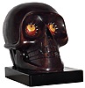 Oswald Uhrenfabrik, Germany, "Skull" rotating eye time piece, 30 hour, time only spring driven movement in a composition case with red and yellow eyes and black pupils, c1930