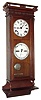 Seth Thomas Clock Co., Thomaston, Conn., "Suez" perpetual calendar wall clock, 8 day, time and strike, spring driven movements in a walnut case with painted metal double dial, c1886