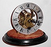 Eureka Clock Co., London, movement now associated with wood base and glass dome, c1906