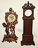 Ansonia Clock Co., New York, 30-hour cast metal novelty timepiece c1900, plus miniature wood long case
