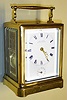 Paul Garnier, Paris, France Series III carriage clock in brass corniche case with 8 day, time, half hour bell strike, hour repeat and alarm, spring driven movement with original chaff cutter platform escapement and Roman numeral white enamel dial, c1860 s#3018