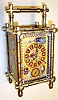 France, carriage clock in bamboo style brass case with enamel floral, butterfly, fish and avian decorations with 8 day, time, half hour strike and hour repeat, spring driven movement and similarily decorated Roman numeral dial, c1890