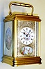 France, carriage clock in gilded brass cannelee case with multicolor painted porcelain panels each having a finely engraved silver mask, 8 day, time, half hour strike and hour repeat with Roman numeral white enamel dial, c1890