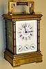 France, carriage clock, Grande Sonnerie with calendar, alarm and repeat in Anglaise brass case with turned columns, 8 day, spring driven movmement with multicolor Roman numeral whtie enamel dial, c1885