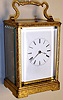 Perrin Paris, France carriage clock in engraved corniche brass case with 8 day, time, half hour strike and hour repeat, spring driven movement with fine platform escapement and helicoil hairspring and Roman numeral white enamel dial, c1840
