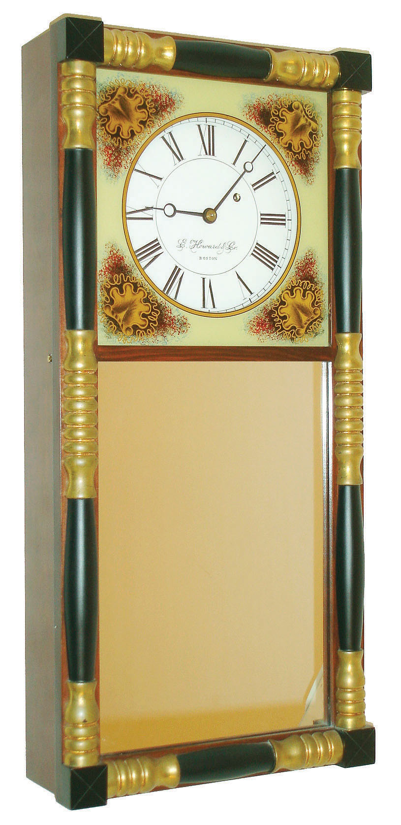 E. Howard &amp; Co., Boston, Mass., reproduction NH mirror wall clock, 8 days, time only, weight driven movement signed in a mahogany case with typical NH turned half columns gilded and ebonized and reverse painted top glass and lower mirror tablets, painted metal dial, dated 1990 — Antique Clocks Price Guide