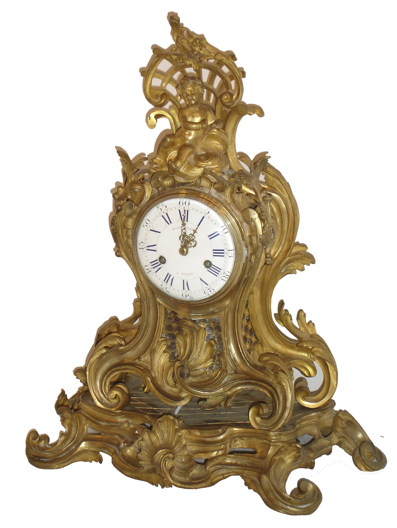 Balthazard, a Paris, large gilt bronze clock in the rococo style, the case and base decorated with acanthus leaves and c scrolls, shells, and other naturalistic ornament, the top with a putto seated on clouds before an openwork scallop shell, also with c scrolls and foliage, the front and sides with strap work fret backed with silvered copper foil, molded brass bezel with convex beveled glass over white enamel dial with blue Roman numerals and Arabic black outer 5 minute markers, and signed in pink enamel "BALTHAZARD A PARIS", gilt Louis XV style hands, the tip of the minute with dolphin, large round 8 day French movement with silk suspension and recoil escapement, striking on a bell, c1760 — Antique Clocks Price Guide