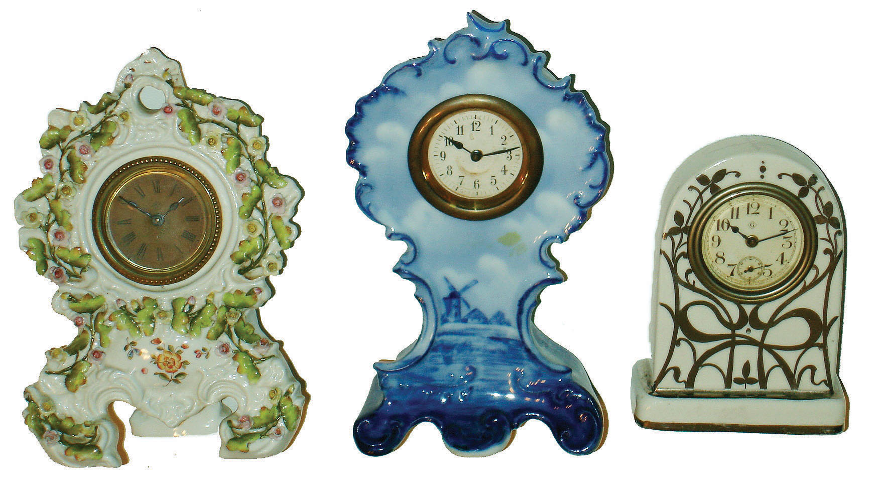 Clocks- 3 (Three) 30 hour time only porcelain novelty clocks:  German Delft style; Gilbert "Fayette" silver and white; Ansonia in German elaborate floral case; c1920 — Antique Clocks Price Guide
