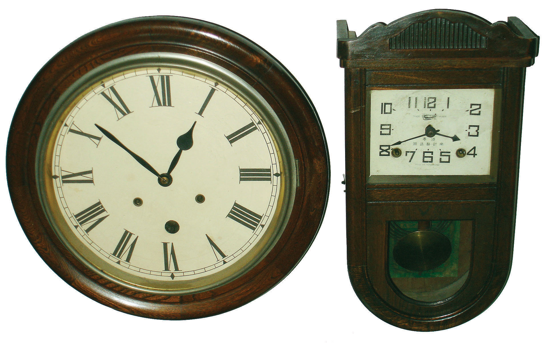 Clocks- 2 (Two) Asian 8 day time and strike stained wood wall clocks: one with "Made in Hong Kong" on its painted metal dial; the round one with mock pendulum aperture in its dial; c1910 — Antique Clocks Price Guide