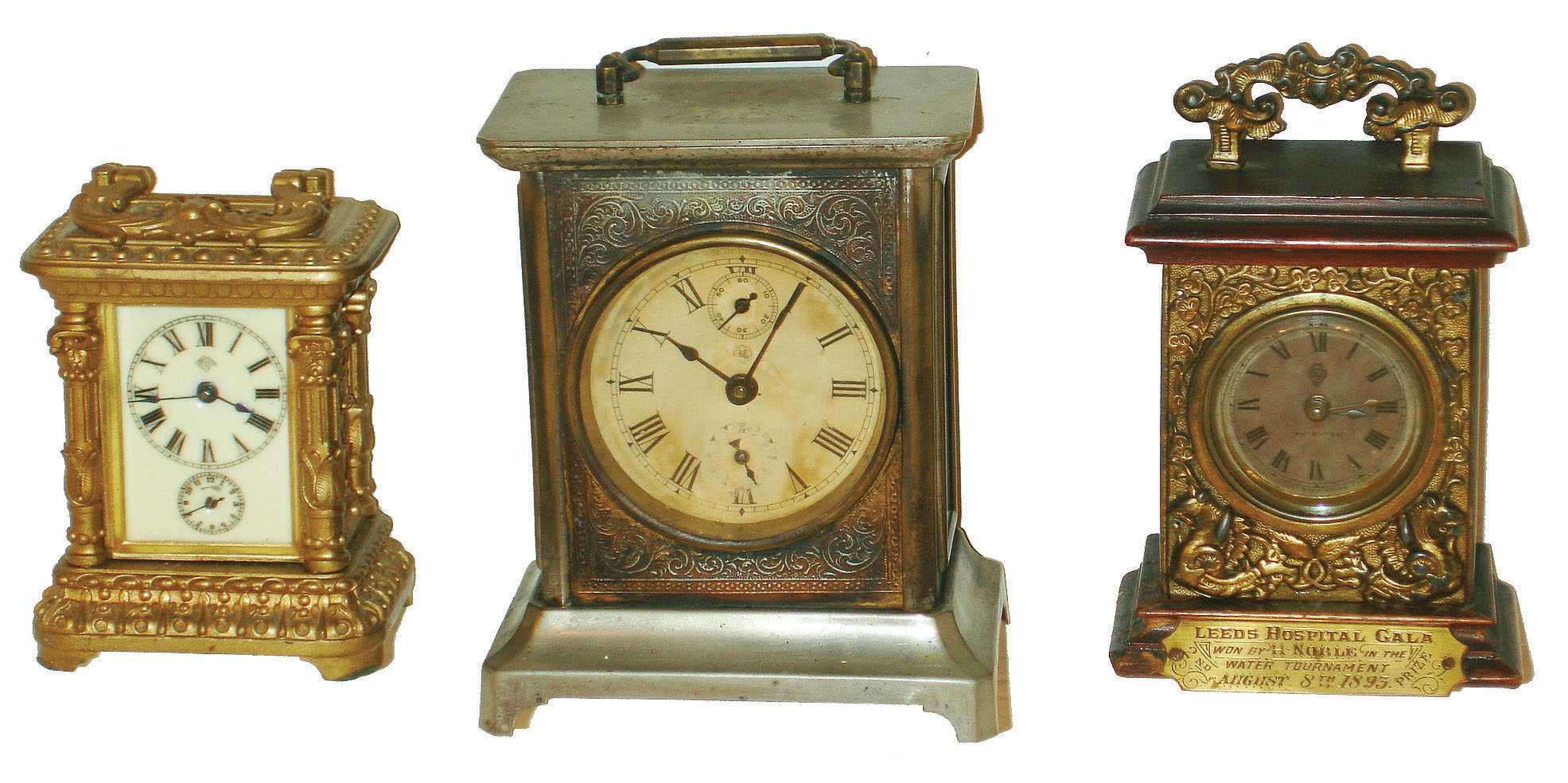 Clocks- 3 (Three) small metal and wood 30-hour carriage clocks: British United with Leeds Hospital 1893 presentation; Ansonia fancy alarm; Seth Thomas alarm — Antique Clocks Price Guide