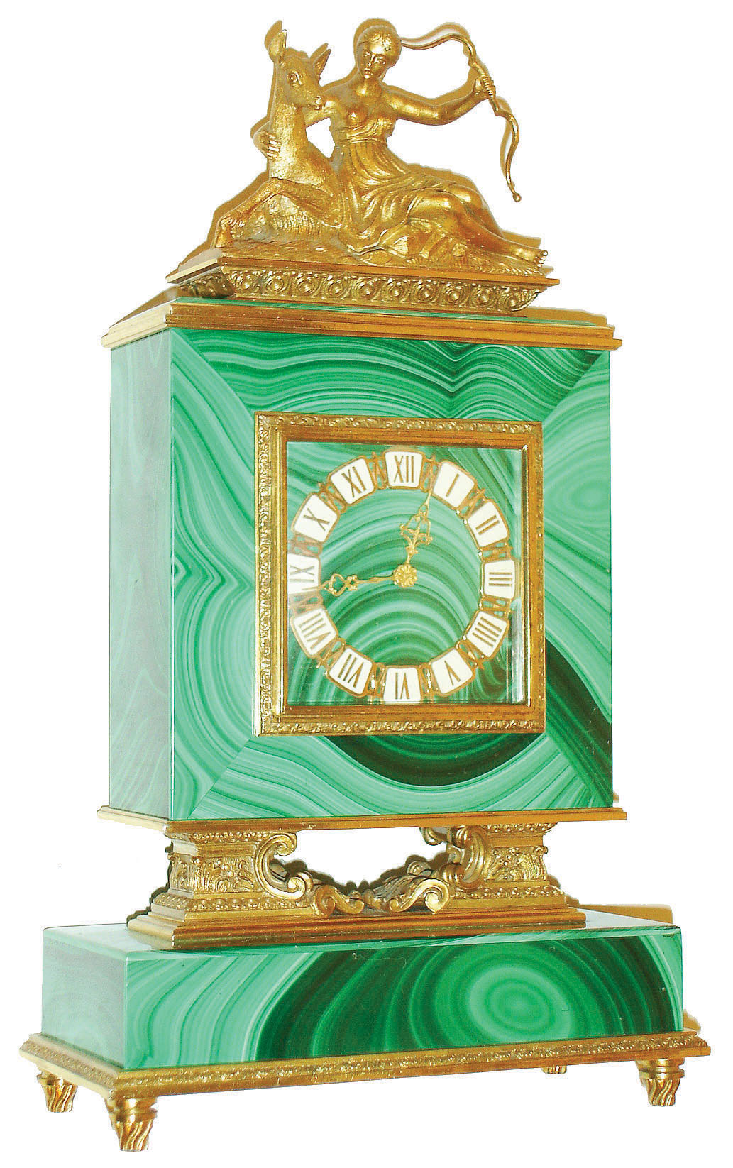 Switzerland, malachite and gilt brass desk or bedside clock, stone base with gilt molding and feet, the square clock case on cast architectural supports with scrolls and acanthus leaf decoration, the top with gilt figure of Diana and a deer, rear door gilt and with engraved decoration, Roman numeral gilt and white enamel chapter ring with fancy gilt hands, time and alarm movement with lever escapement, c1960 — Antique Clocks Price Guide